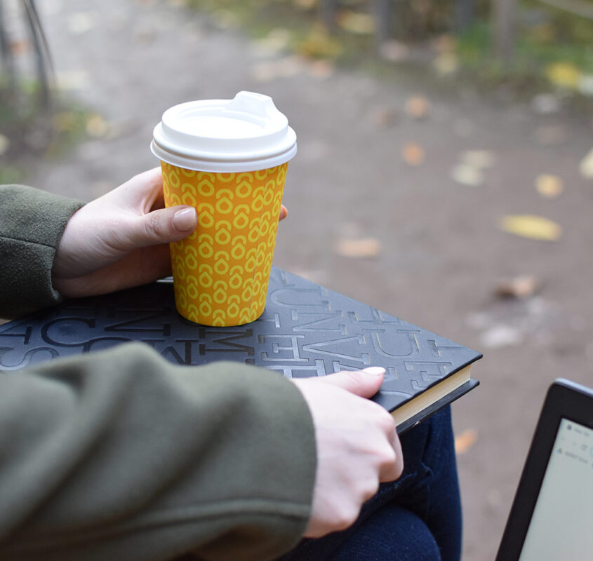 Girl with a coffee and sketchbook